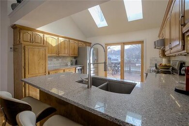 The updated kitchen is light and bright.  The skyl