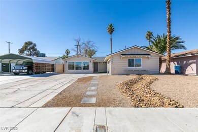 Single story home with a detached carport, board a
