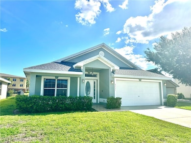 Single story home featuring concrete driveway, a f