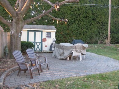 Lovely paver patio under the shade of the trees in