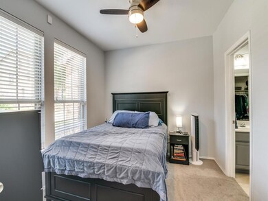 Carpeted bedroom with ceiling fan 1st Floor