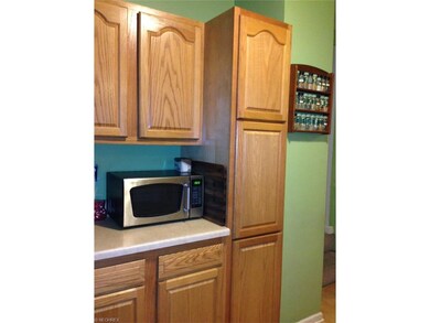 Kitchen with nice counter tops and cabinets.
