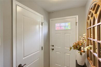 Entry on street level with door to the garage.