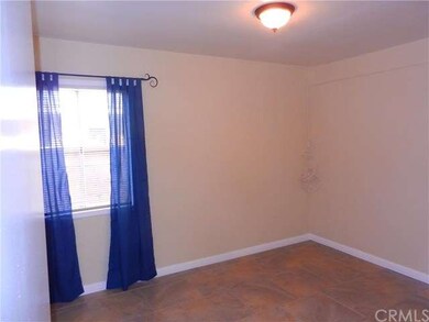 bedroom or den with tile floors