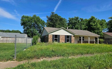 Single story home with brick siding
