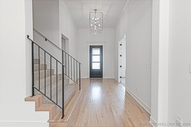 Light stained white oak wood floors and Iron stair
