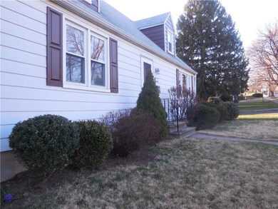 view of corner property; nice landscaping