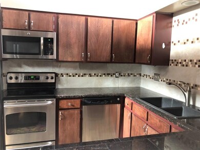 Kitchen with appliances with stainless steel finis