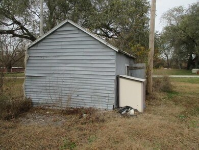 View of outdoor structure with view of scattered trees