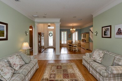 LIVING ROOM TO DINING AND FOYER