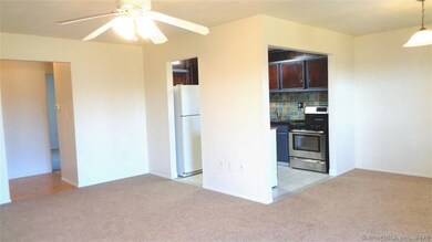 Living room and dining room with sliders to balcony