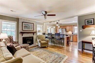 Family Room with Ceiling Fan and Pellet Fireplace