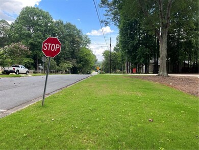 View of asphalt road featuring traffic signs