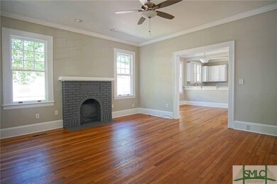 Living Room opens to Dining Room and Kitchen