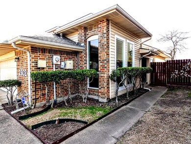 View of home's exterior with brick siding, an atta