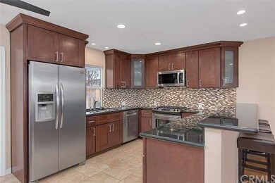 Notice the glass door inserts on 2 of the upper ca