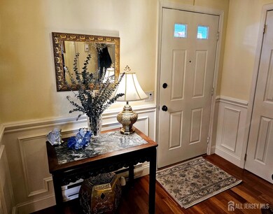 Welcome your guests into your home by greeting them in your beautiful foyer with custom moldings, hardwood floors and guest closet