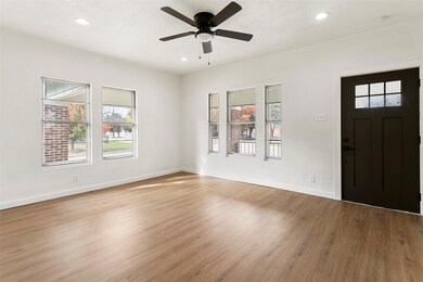 Entrance foyer with ceiling fan and light hardwood / wood-style floors
