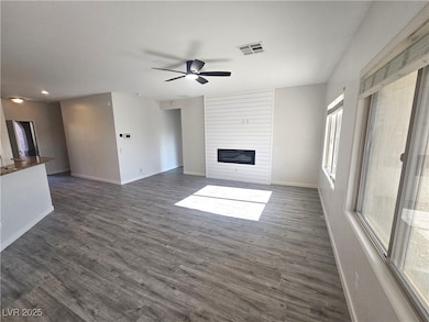 Unfurnished living room with a large fireplace, ce