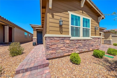 View of side of property featuring stone siding