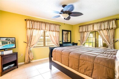 Master bedroom with sliders out to the Florida Roo