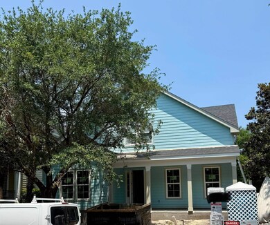 View of front facade featuring a porch and a shingled roof