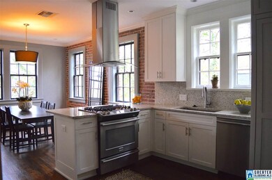 Large open kitchen with upgraded appliances, grani