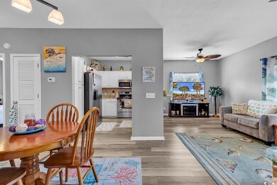 Dining area featuring light wood-style flooring, b