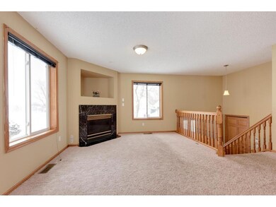 Upper level living room with gas fireplace