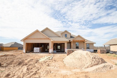 View of front of property with roof with shingles, a patio, and board and batten siding