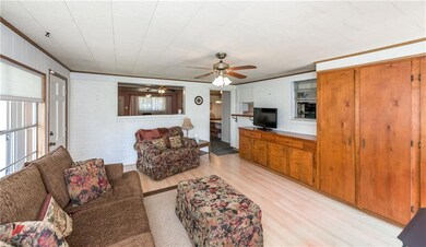 ANOTHER VIEW OF THE DEN SHOWING THE BUILT INS