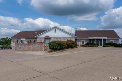 Ranch-style house with brick siding