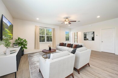 Living area with light wood finished floors, ceil