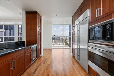 Kitchen featuring beverage cooler, built in appli