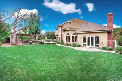 Large private yard offers a park like setting to r
