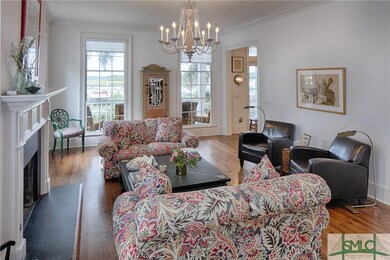 Living Room with 10 Foot Ceilings and Triple-Hung 