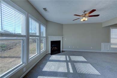 Unfurnished living room featuring carpet floors, a