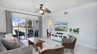 Living area featuring light tile patterned floors,