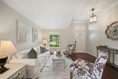 Entry opens onto a formal living room area.