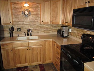 Kitchen. This newer kitchen is efficient and attra