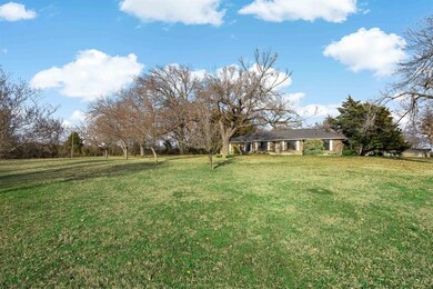 The front lawn is gigantic and sits back from CR-3