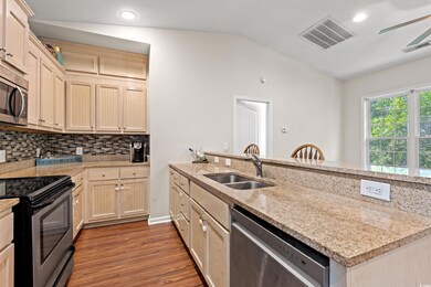 Kitchen with visible vents, appliances with stainl