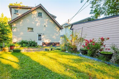Rear view of property featuring a yard