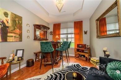 This dining room is a marvelous place to relax . Love that lighting!