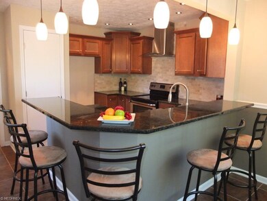 Beautifully remodeled kitchen with bar seating for