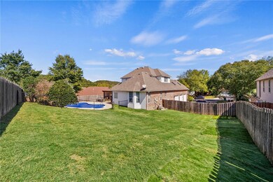 Separate fenced back/side yard perfect for pets or play area.