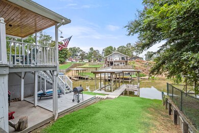 View of yard, deck and boat dock