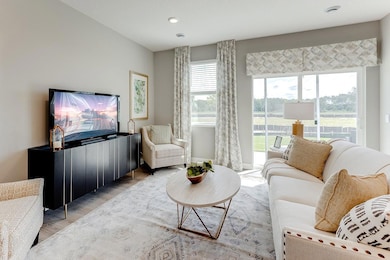 Time to relax and kickback in the well lit living area. *Photos are of a previously staged model*