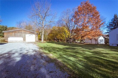 LONG GRAVEL DRIVEWAY BACK TO HUGE DETACHED GARAGE