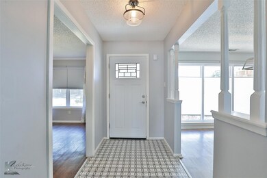 Foyer featuring plenty of natural light, a texture